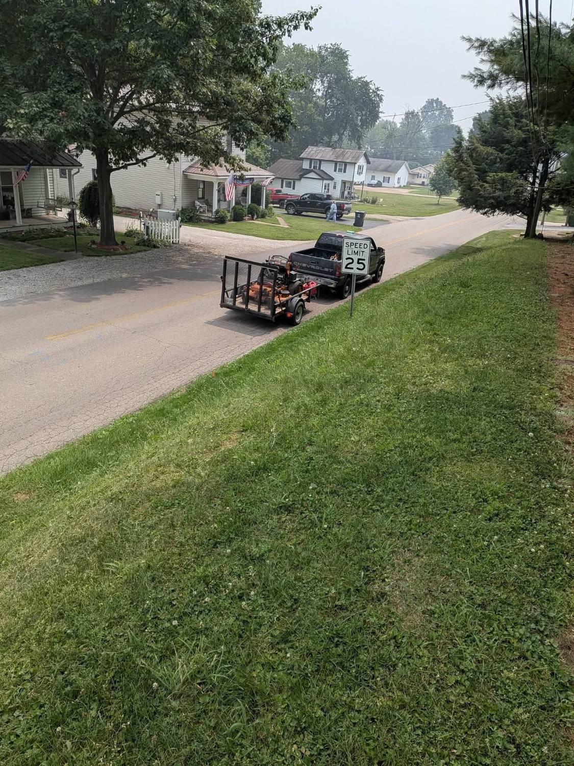 The Turf Pro truck and trailer parked on a street